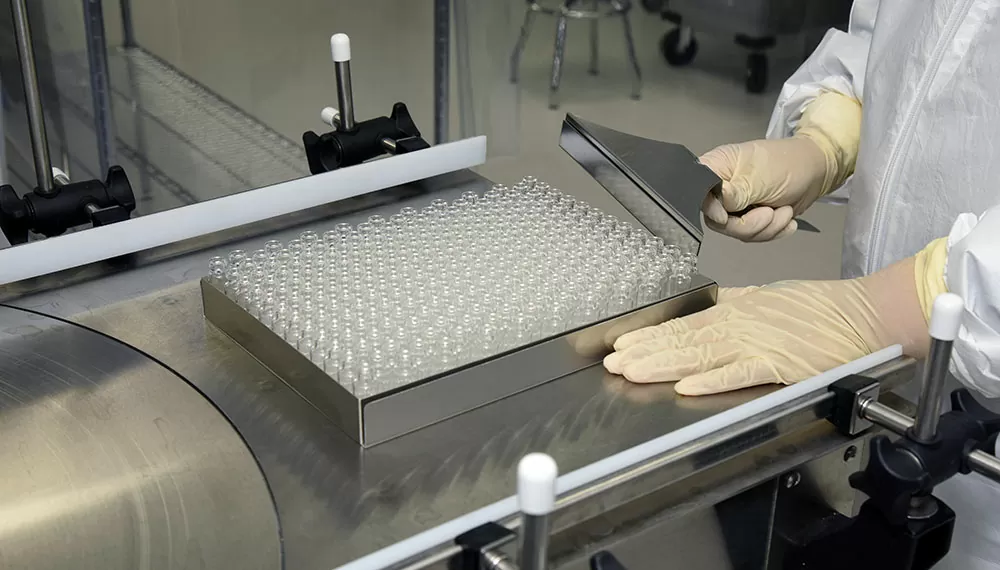 Afton Ready-To-Fill pre-sterilised components handled by expert team member